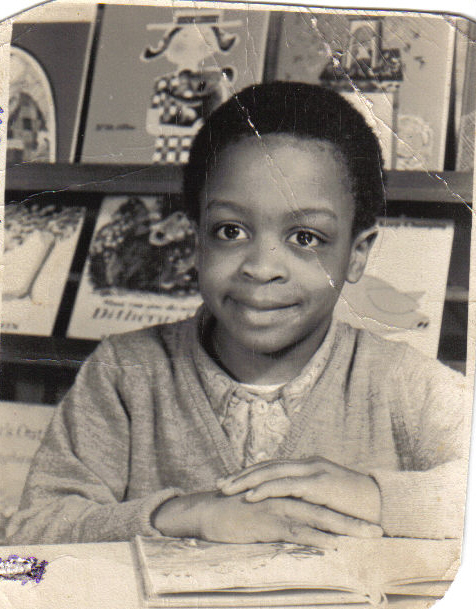Godfrey Oswald at school aged 5 years at Franciscan Primary School Library, Tooting, London.